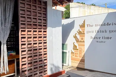 a wall with a sign that says the tutorials you think you have time at Sekeca Coliving in Kuta