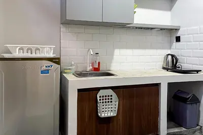 a kitchen with a sink and a counter top at Sekeca Coliving in Kuta