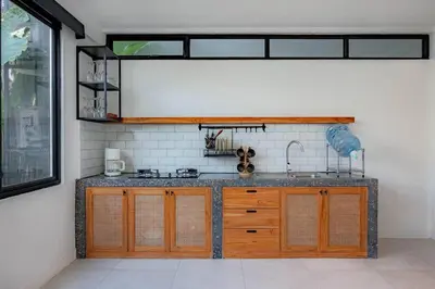 a kitchen with a sink and a counter top at The Drupadi Apartments Town House LOLA in Seminyak