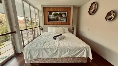 a bedroom with a bed with a towel on it at Oasis Villa Canggu in Kerobokan