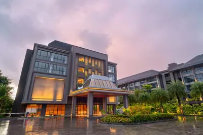 a building in the rain with a building at Lavaya Resort Nusa Dua Bali in Nusa Dua