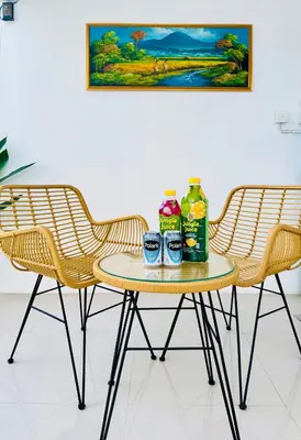 two chairs and a table with drinks on it at Y&J in Seminyak