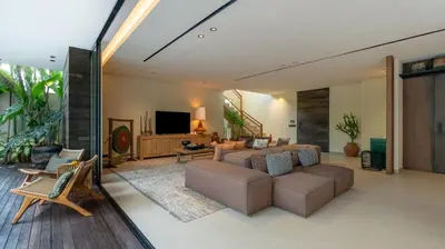a living room with a couch and a tv at Villa Fiji by Villa Finder in Canggu