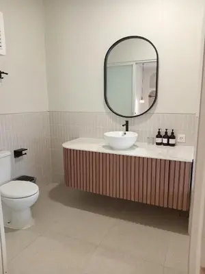 a bathroom with a sink and a mirror at Sofira Villa 2 bedroom in Nusa Dua