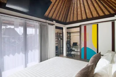 a bedroom with a bed and a view of a desk at 3BR Villa Kita - Minggu Villas-Special Stay Bonus in Seminyak