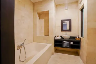 a bathroom with a tub and a sink at Villa Narada - Convenient Location - Private Pool - 3BR Villa in Seminyak