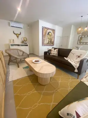 a living room with a couch and a coffee table at Villa EL NIS - LEGIAN - 4 Bedroom - 4 Bathroom - Luxury in Legian