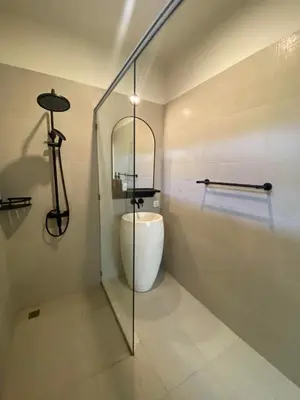 a bathroom with a glass shower and a toilet at Villa EL NIS - LEGIAN - 4 Bedroom - 4 Bathroom - Luxury in Legian