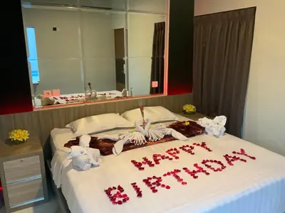 a bed with a happy christmas sign on it at Bali queen elephant boutique villa in Jimbaran