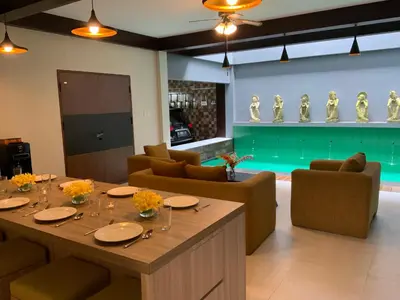 a dining room with a table and chairs at Bali queen elephant boutique villa in Jimbaran