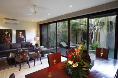 a living room with a couch and a table at Cozy 2 BR Private Pool Villa in Seminyak