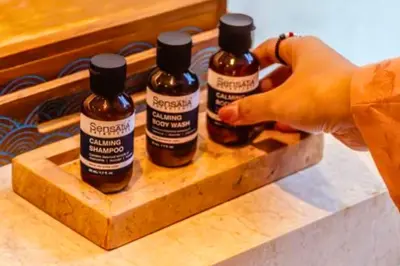 three bottles of honey sitting on a wooden tray at Smart 1 BR Villa with Private Pool in Seminyak