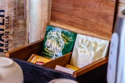 a wooden box filled with books on a table at Smart 1 BR Villa with Private Pool in Seminyak