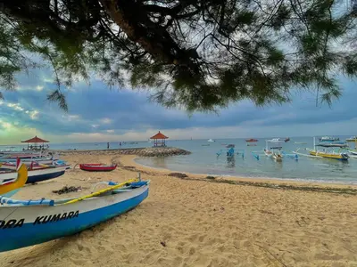 a group of boats on a sandy beach at Abian Klumpu Villa & Spa Sanur Bali in Sanur
