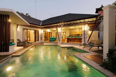 a swimming pool in the backyard of a house at Sudha Villa Bali A in Seminyak