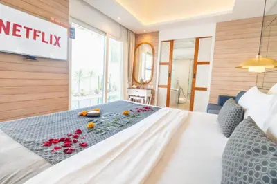 a bedroom with a bed with flowers on it at Romantic 1 BR Villa with Private Pool in Seminyak