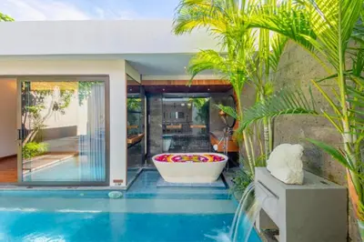 a swimming pool with a tub in a house at Modern 1 BR Villa with Private Pool in Seminyak