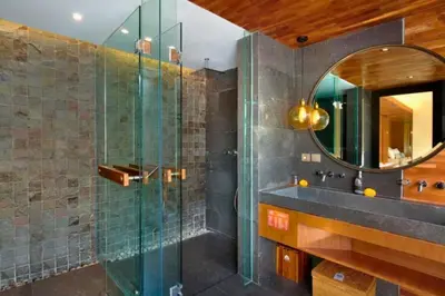 a bathroom with a glass shower and a sink at Modern 1 BR Villa with Private Pool in Seminyak