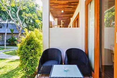 a table and two chairs on a porch at Beautiful 1BR Deluxe Double Room in Canggu
