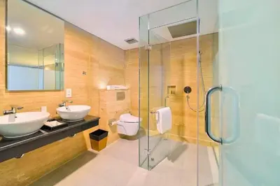 a bathroom with a sink and a toilet and a shower at Viorel 1 BR Whirlpool Suite Room in Seminyak