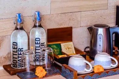 a counter with two wine bottles and a coffee maker at Luxury 2 BR Villa with Private Pool & Bathtub in Seminyak