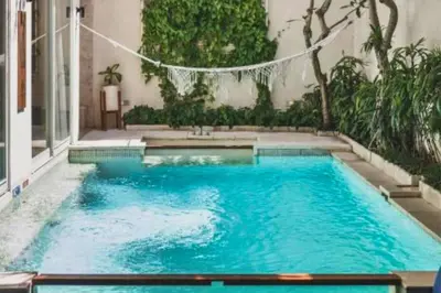 a swimming pool in the middle of a building at Luxury 2 BR Villa with Private Pool & Bathtub in Seminyak