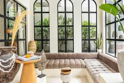 a living room with a couch and a table at Casa Toledo 1 Bedroom Seminyak - Kerobokan in Seminyak