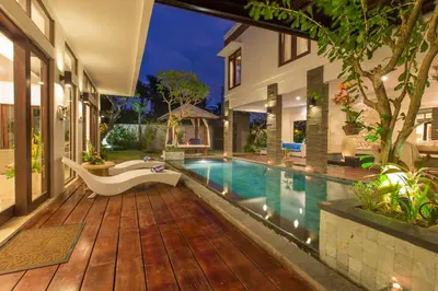 a swimming pool in a villa with a bathtub at Villa Club Corner Residence by Nagisa Bali in Canggu
