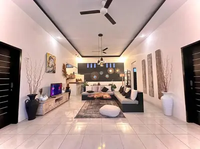 a living room with a couch and a table at 2 BR Villa Rhapsody - 5 Mins to Seminyak/Umalas in Seminyak