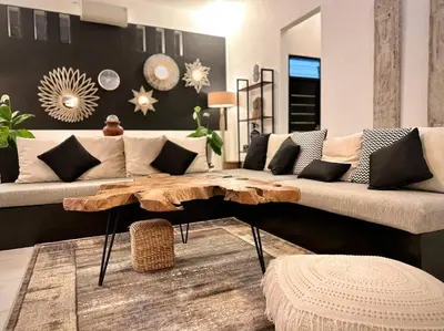 a living room with a couch and a wooden coffee table at 2 BR Villa Rhapsody - 5 Mins to Seminyak/Umalas in Seminyak