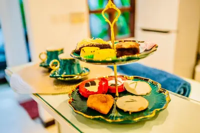 a glass table with two plates of food on it at Villa Julissa in Seminyak