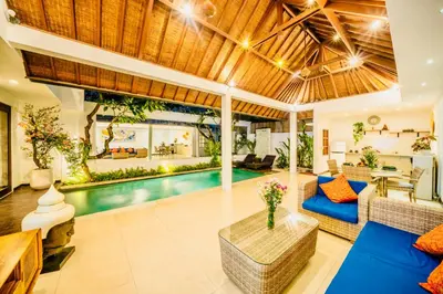 a villa with a pool and a living room at Villa Julissa in Seminyak