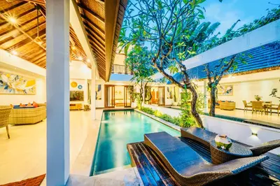 an indoor swimming pool in a house at Villa Julissa in Seminyak