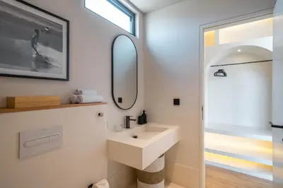 a bathroom with a sink and a mirror at Villa Maverick - Brand New Classy 4BR Villa in Canggu in Canggu