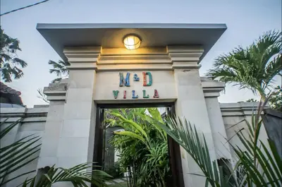 a sign over the door of a hotel at Villa MD Tranquil 6BR Villa at Eat Street in Seminyak