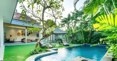 a pool in the backyard of a villa at Villa GrandLux Bali 2 Bed Villa Pool Big Garden in Seminyak