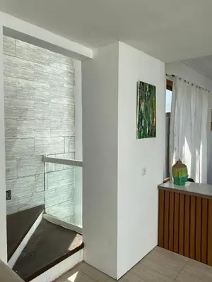 a bathroom with a glass shower in a room at 3 BR Chrysanthemum Villa nusadua in Nusa Dua