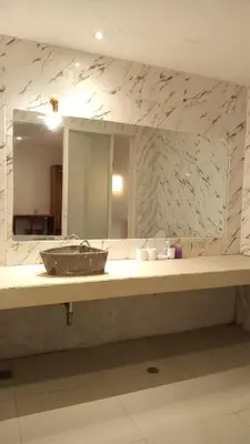 a bathroom counter with a sink and a mirror at 3 BR Chrysanthemum Villa nusadua in Nusa Dua