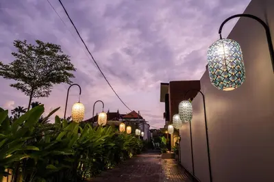 a street with lights on the side of a building at Akhila 4 - 1 BR modern tropical villa at the heart of Seminyak in Seminyak