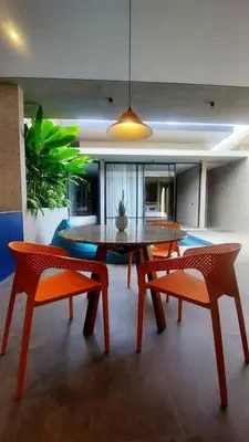 a dining room with a table and two chairs at Akhila 5 - 1 BR modern tropical villa at the heart of Seminyak in Seminyak