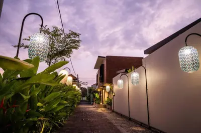 a street with lights on the side of a building at Akhila 5 - 1 BR modern tropical villa at the heart of Seminyak in Seminyak