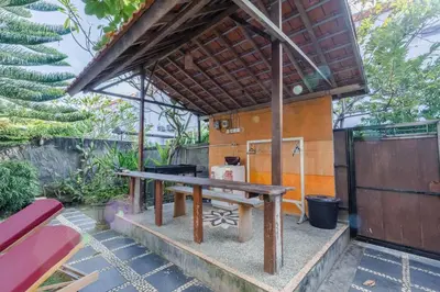 a picnic table in front of a house at Private 3 Bedroom Villas, 5 mnt to Beach Nusa Dua in Nusa Dua