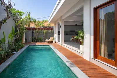 a swimming pool in the backyard of a house at Sundaze 1 - Private Vila in Canggu with Huge Pool in Kerobokan