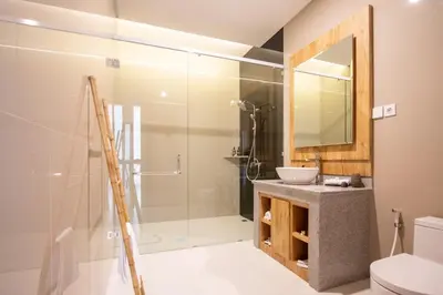 a bathroom with a shower and a sink at Sundaze 1 - Private Vila in Canggu with Huge Pool in Kerobokan