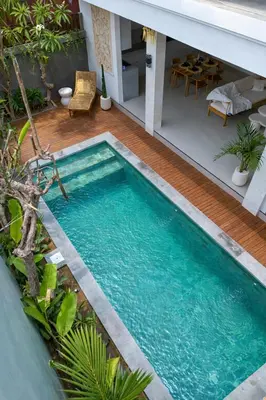 a swimming pool in the backyard of a house at Sundaze 1 - Private Vila in Canggu with Huge Pool in Kerobokan
