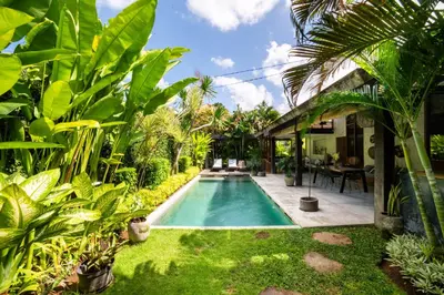 a swimming pool in the yard of a house at Anggana Villa 2 in Canggu