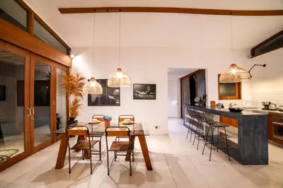 a kitchen and dining room with a table and chairs at Anggana Villa 3 in Canggu