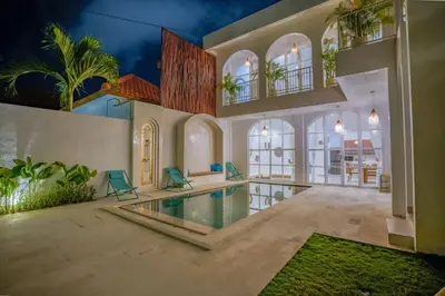 an indoor swimming pool in a house with a villa at Stunning tropical 3bed Villa in Canggu