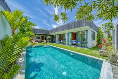 an exterior view of a villa with a swimming pool at Chic Tranquility Modern yet Timeless 3BD Villa in Canggu