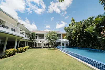 an exterior view of a villa with a swimming pool at CassaMia Bali - Spacious Luxury 5 Bedroom Villa in Jimbaran